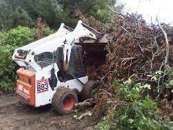 bobcat mini tractor clearing yard debris in el cajon ca
